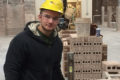 Johnathon Crouch, a masonry apprentice with a Connecticut bricklayers’ union, builds a wall as part of his training.